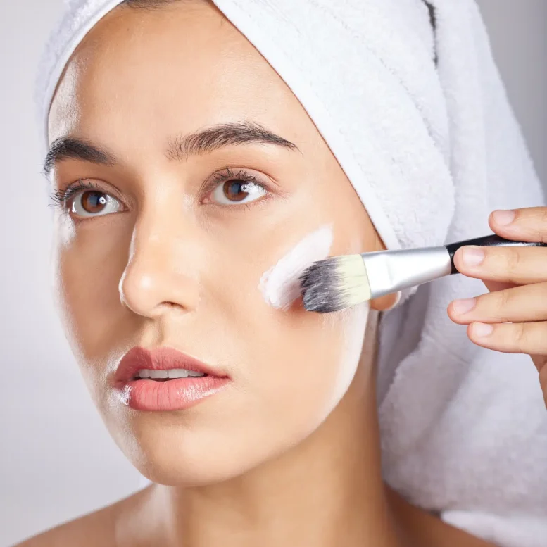 woman-makeup-and-brush-in-studio-with-towel-for-c-2023-11-27-05-27-59-utc